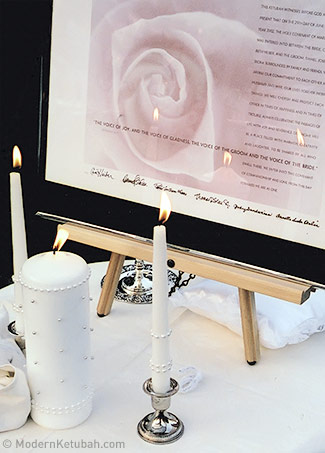 This is my own ketubah during my wedding, framed next to the unity candles.