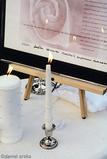 This is my own ketubah during my wedding, framed next to the unity candles.
